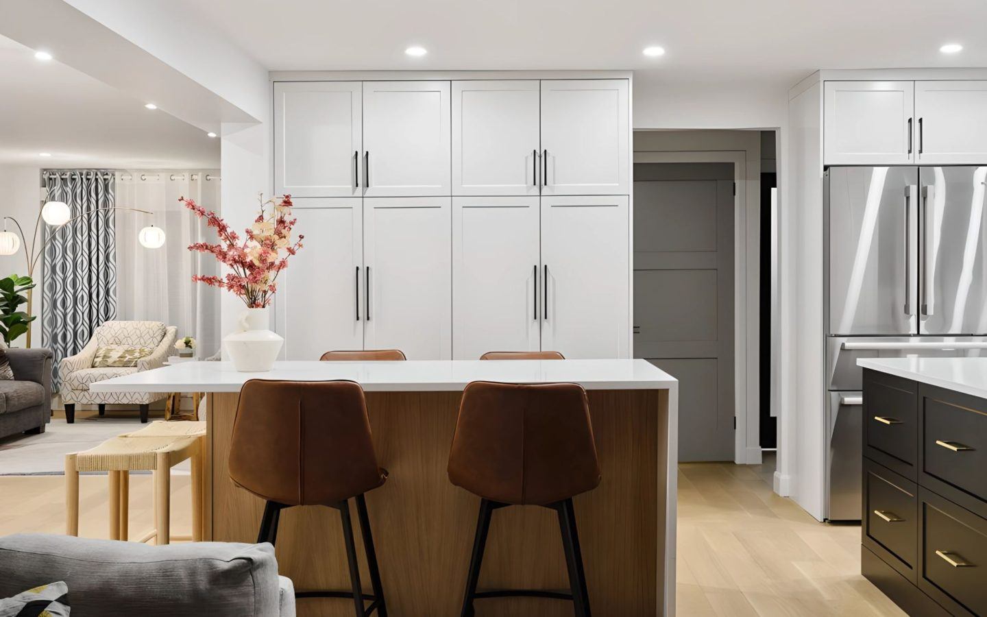 a kitchen with a center island and bar stools