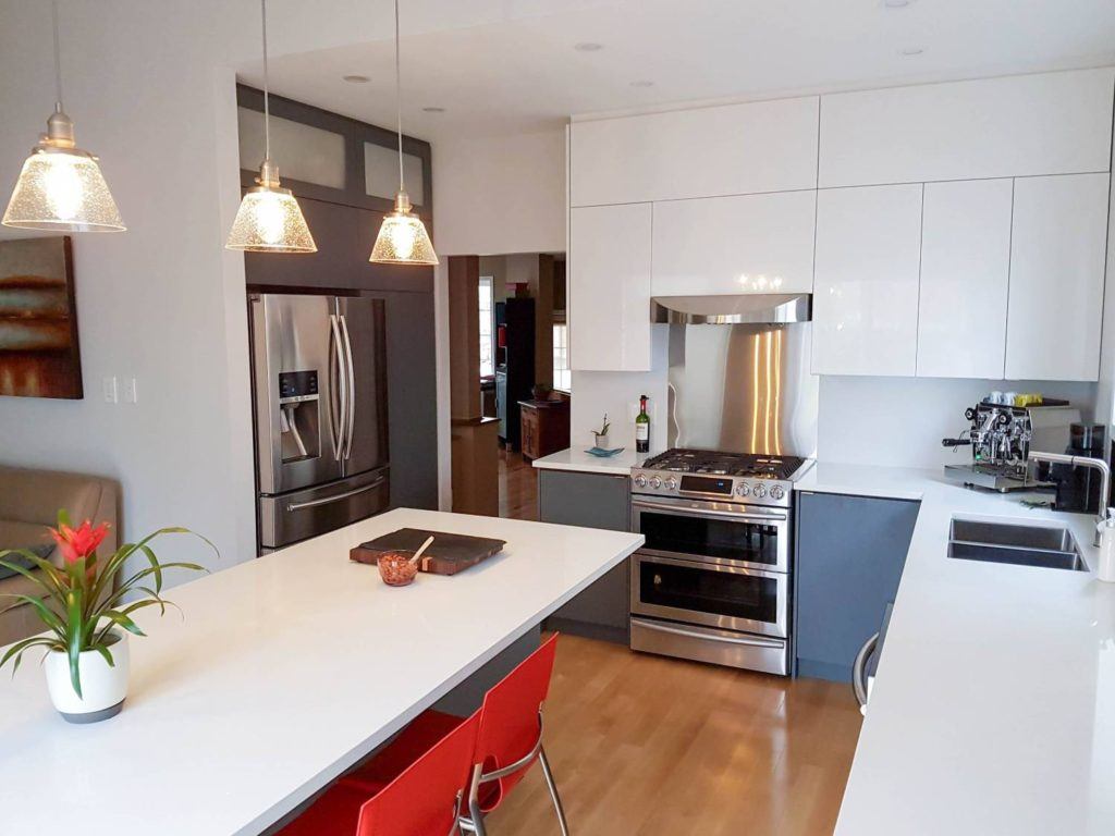 a kitchen with a center island and a stove top oven