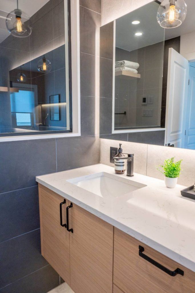 a bathroom with a sink and a mirror